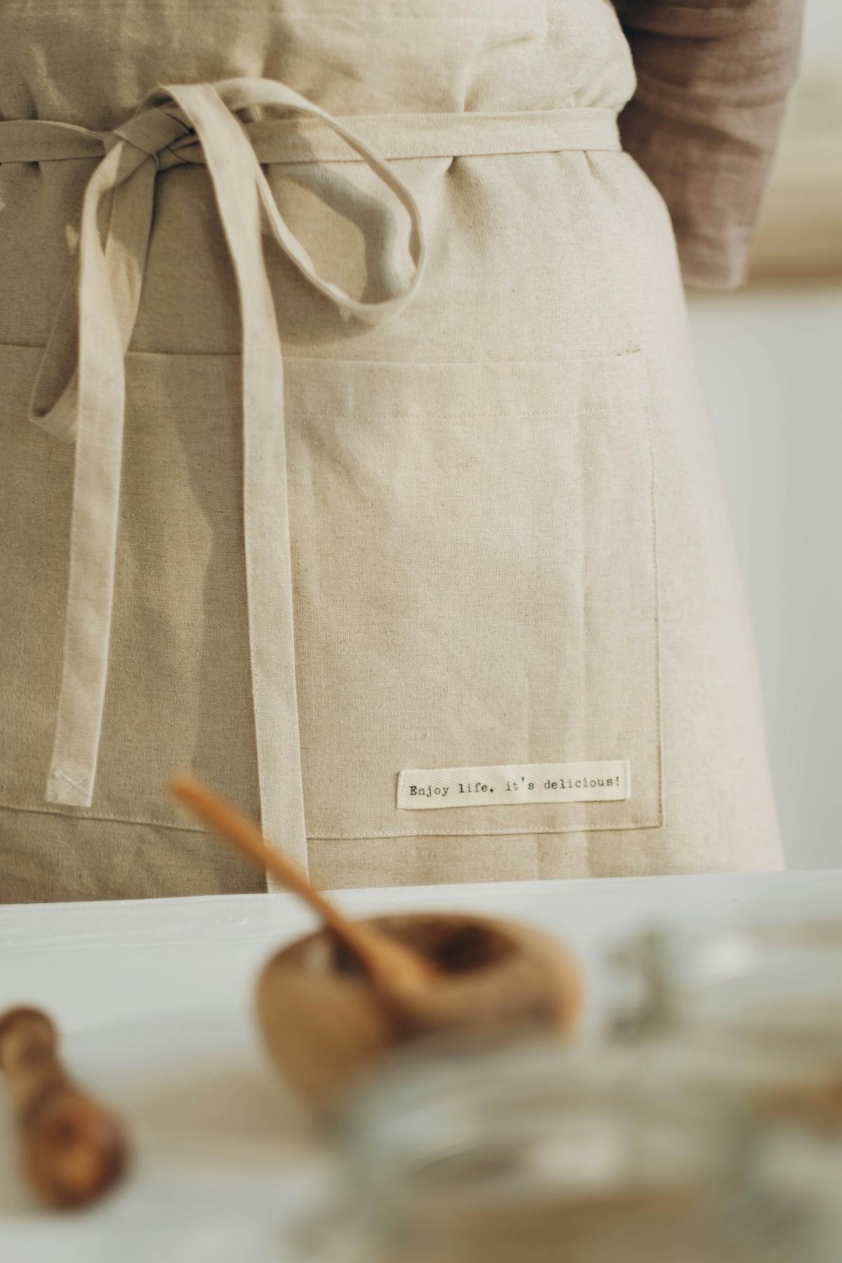 Bone-colored linen apron, front view